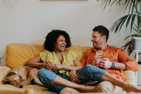 Couple on sofa with dog