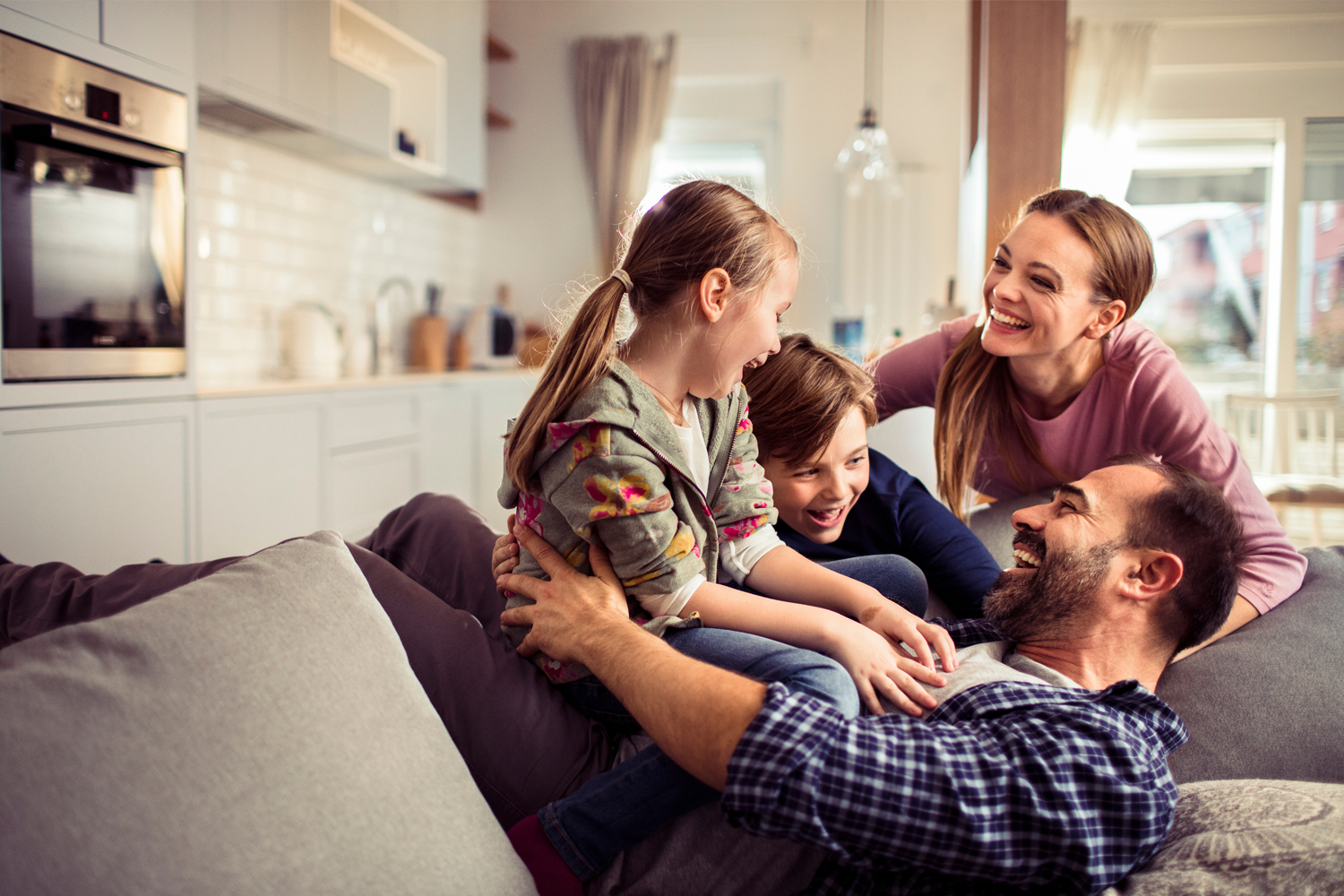 Moments Worth Moving For | Family on the Sofa